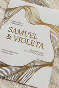 Load image into Gallery viewer, White Invitation with gold foiled flowing lines and names on an ivory background