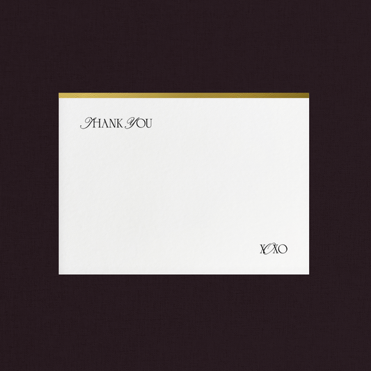 White thank you card with gold foil accent
