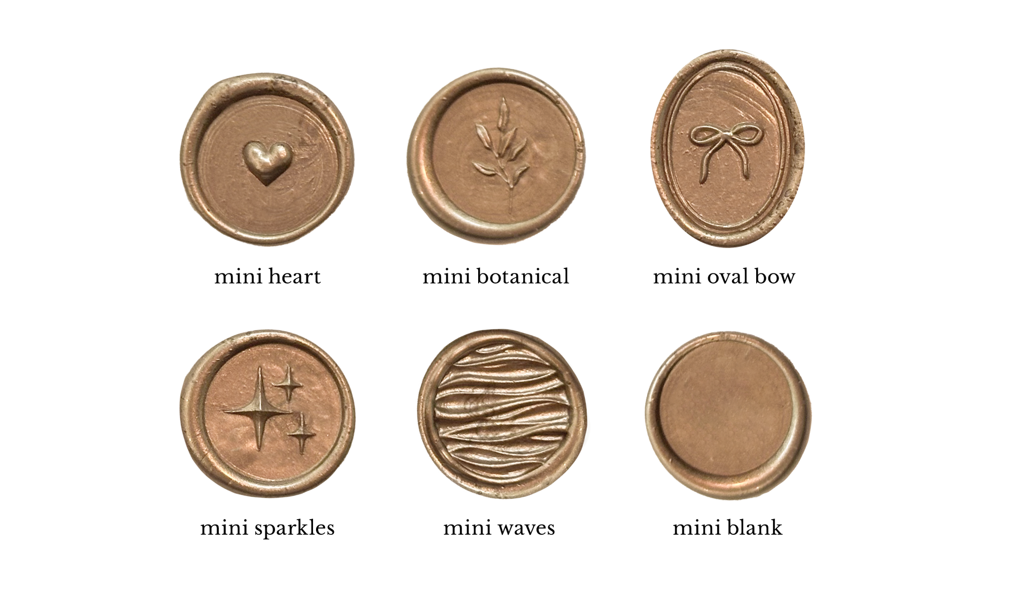 Six gold wax seal stamps: a heart stamp, a botanical stamp, a bow stamp, a sparkle stamp, a wave stamp, and a blank stamp